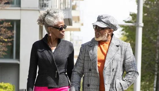 Two people walk together and chat.