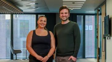 Two coworkers standing