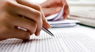 A person holding a pen