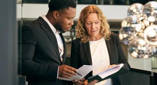 Photo of two people working