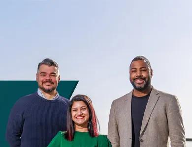 Three people standing in a row