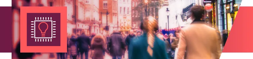A crowded city street with blurred pedestrians and an idea‑chip icon on the left.